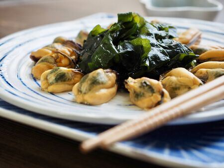 Asian food mussels and seaweed and soy sauceの写真素材