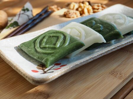 Korean traditional food jeolpyeon, pounded rice cake and Walnutの写真素材