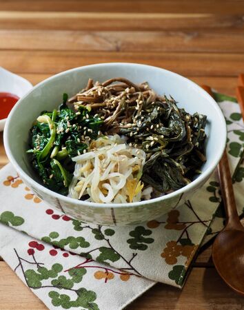 Korean traditional food Rice mixed with vegetables, wild greensの写真素材
