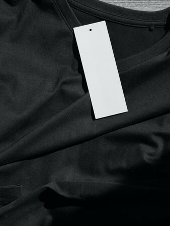 Black V-neck Short Sleeve T-shirt and clothing labelの写真素材