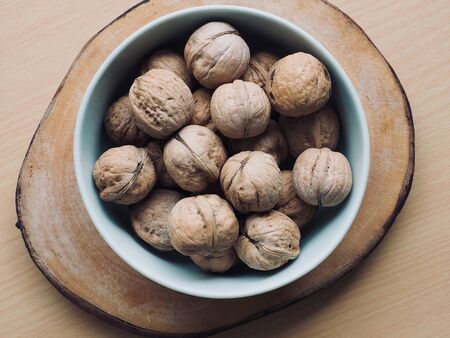 Organic Walnuts in Porcelain Bowlの写真素材