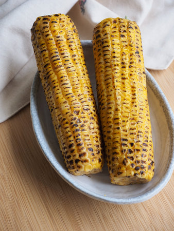 2 yellow roasted corn, food