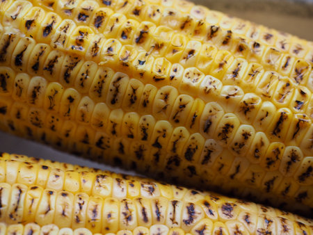 2 yellow roasted corn, food