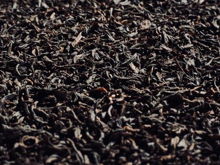 Dried black tea leaves background