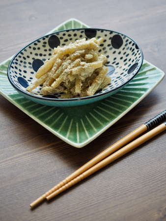 Korean traditional food Petasites japonicus and Perilla seeds stir-fryの写真素材