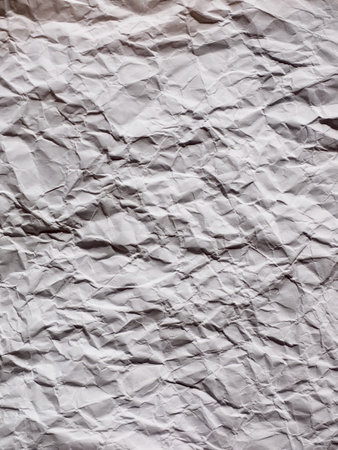 Crumpled white paper background, textureの写真素材