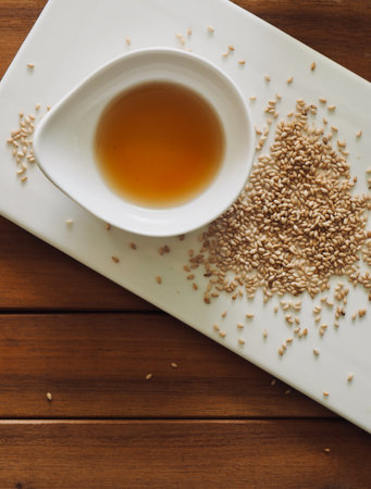 White porcelain plate, sesame oil and Sesameの写真素材
