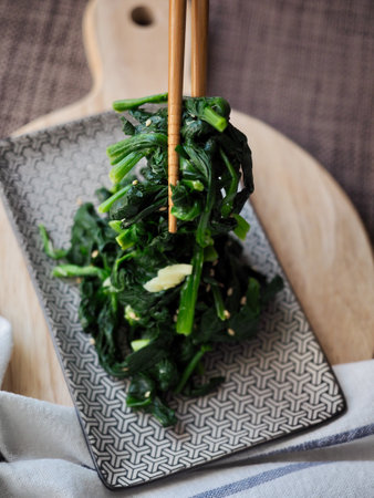 Korean traditional food spinach herbs and chopsticksの写真素材