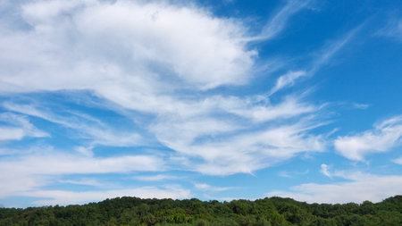 Blue sky, clouds and mountainsの写真素材