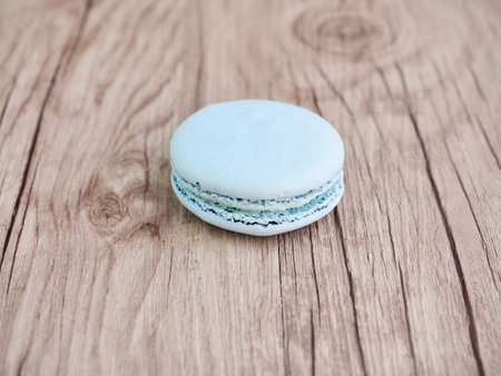 Colorful macaroon on wooden background. Sweet macaroon.の写真素材