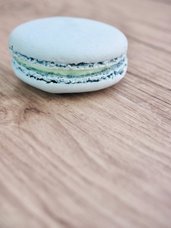 Macaroon on wooden background. Selective focus. Toned.の写真素材