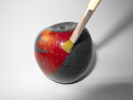 an apple red paint with a brushの写真素材