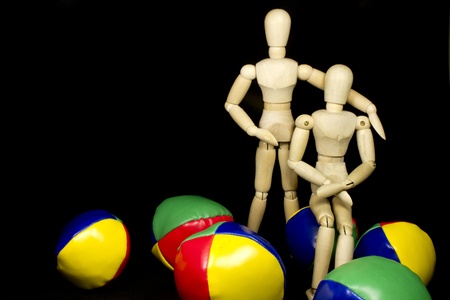 a humanoid couple hugging with juggling balls in bright colorsの写真素材