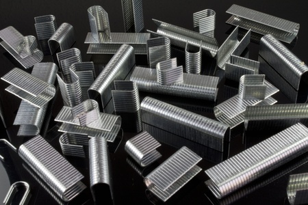 many staples spread on a black backgroundの写真素材