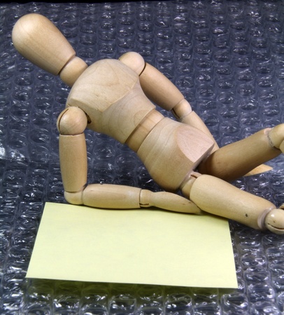 a Humanoid with a note lying on comfortable plastic bubblesの写真素材