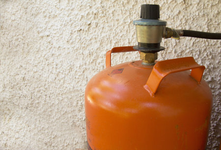 a butane gas orange cylinder