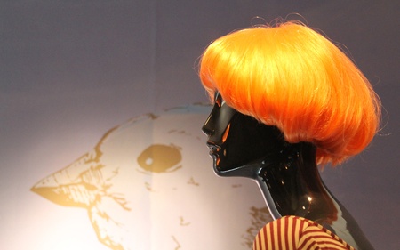Female mannequin with very showy orange wigの写真素材