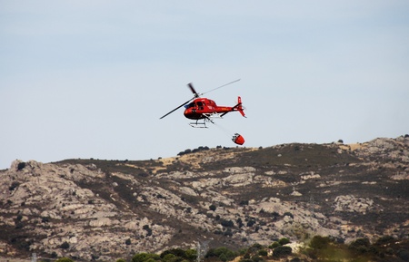 fire fighting helicopters fire on the mountainの写真素材