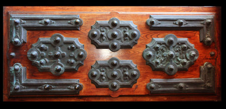 old wooden door with metal ornaments