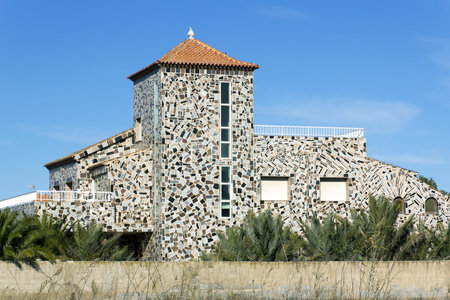 curious house with colored stones in the walls