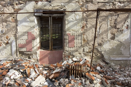 house destroyed by an explosion full of debrisの写真素材