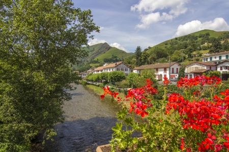 picturesque village in the South of France with many plants and a riverの写真素材