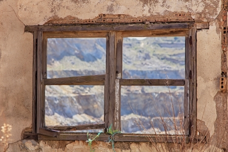 Old window destroyed house in ruins and abandonedの写真素材