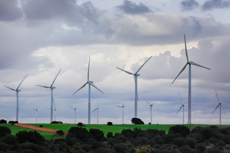 wind energy windmills in a dark storm, electric generatorsの写真素材