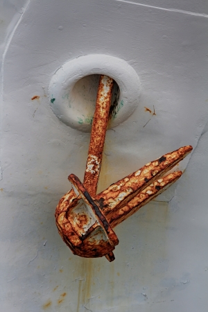 oxidized in the bow of a white boat anchorの写真素材