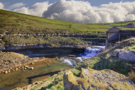 waterfall in a steep meadowの写真素材