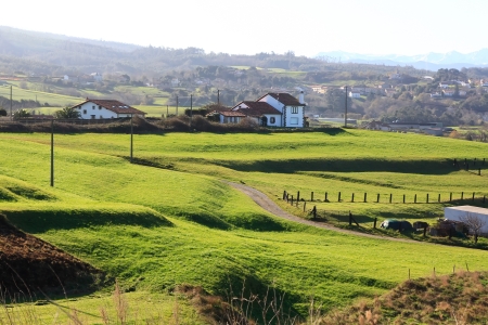 general landscape of pasture area and typical houses of northern Spainの写真素材