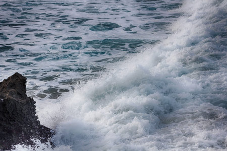 Waves crashing against rocks