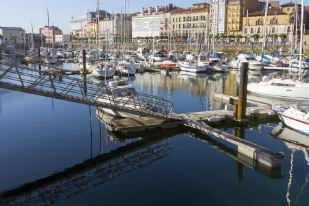 small marina with calm sea in the city of Gijon, Spainのeditorial素材