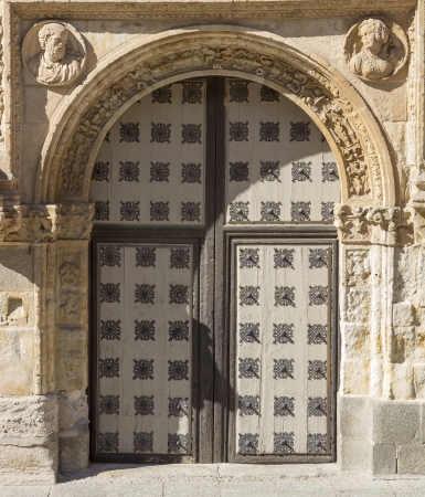 old wooden door with iron ornamentsの写真素材