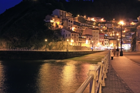 night view of the promenade of the fishing village of Cudillero, Spainの写真素材