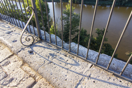 wrought iron fence with her ââelongated scrapsの写真素材