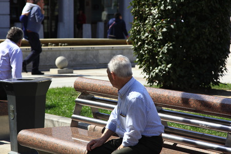 Madrid - Mar 22: unknown older people enjoy the Sun in a park in Madrid on Mar 22, 2013 in Madrid Spainのeditorial素材