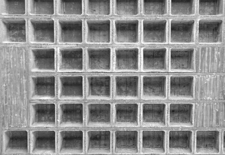 symmetric background holes in concreteの写真素材