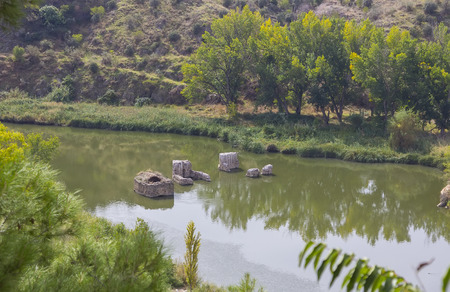 Ruins of a bridge over the river Tajo, Toledo Spainの写真素材