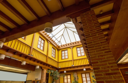 Colorful yellow covered patio and wooden beamsの写真素材