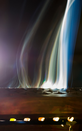 smoke of incense aromatic creating forms on a black backgroundの写真素材