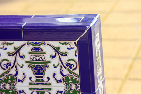 detail of a chair decorated with porcelain tiles