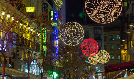 MADRID,SPAIN - DECEMBER 18: The streets of Madrid are filled with lights and people doing their Christmas shopping December 18, 2014 in Madrid Spainのeditorial素材