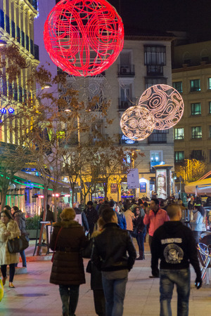 MADRID,SPAIN - DECEMBER 18: The streets of Madrid are filled with lights and people doing their Christmas shopping December 18, 2014 in Madrid Spainのeditorial素材