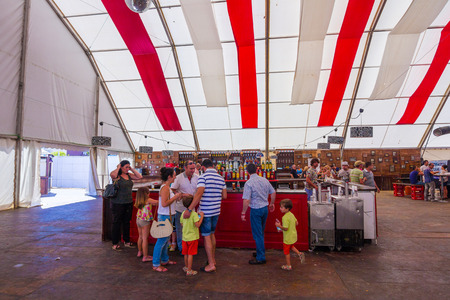 ANDUJAR,SPAIN - September, 6: tents and umbrellas to avoid the sun during the famous Andalusian Horse Fairon September, 6, 2014 in Andujar, Spainのeditorial素材