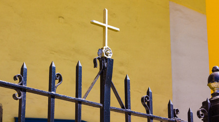 Christian cross on iron fence.の写真素材