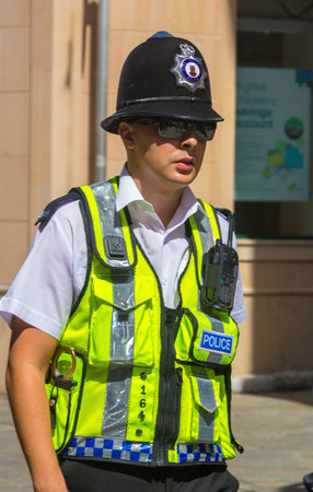 London, England September 3, 2014: Police in the typical English town patrol the streets of the...