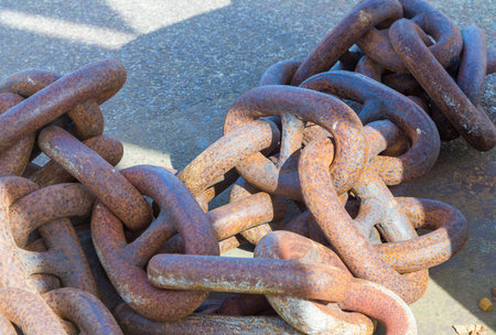 Links of a great chain anchor a boat