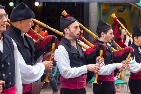 OVIEDO, Spain August 25, 2015: Group of bagpipers to parade through the streets to attract tourism in Oviedo, Spainのeditorial素材