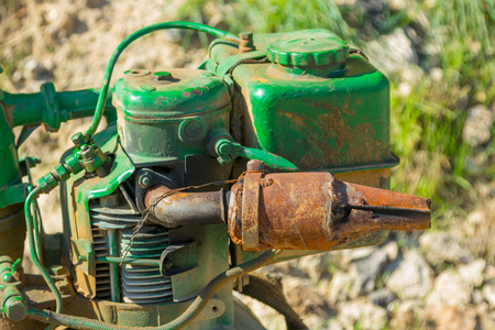 Old green bulldozer on a construction siteの写真素材